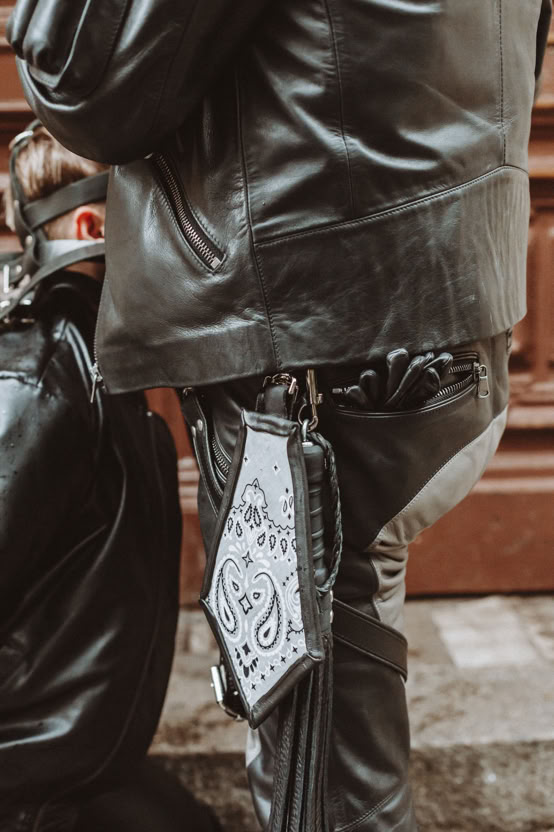Black and white portrait of an elderly veteran holding a sword and pistol.